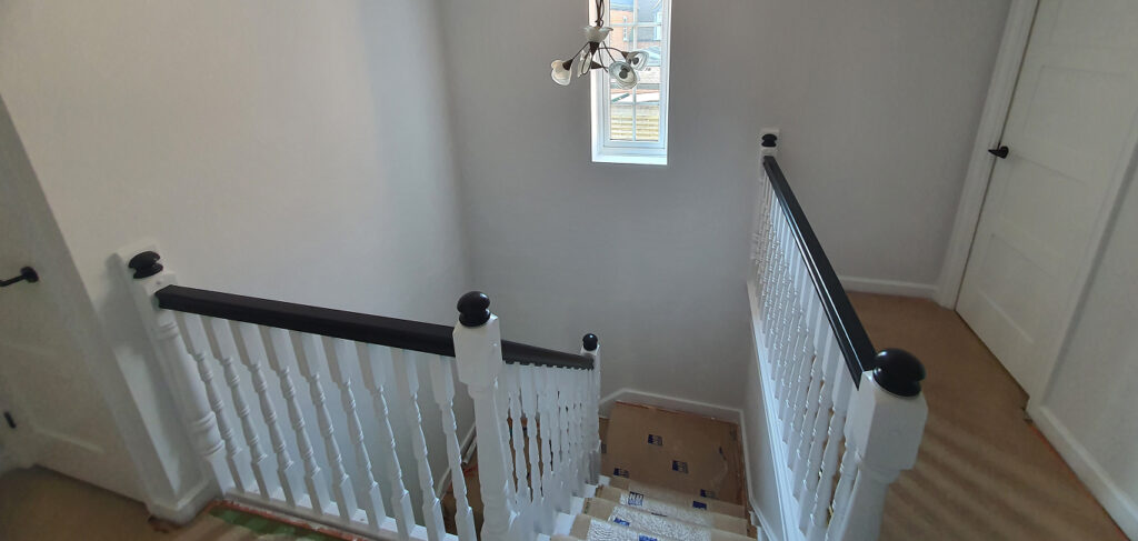 Under-stairs storage painting Bletchley